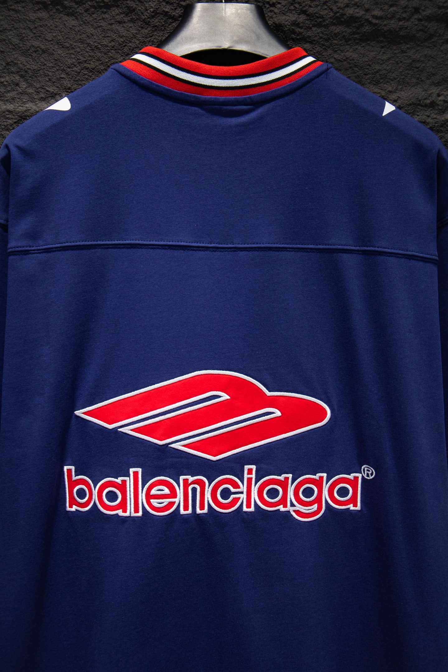 Balenciaga blue short-sleeve shirt front with red-and-white logo and striped collar