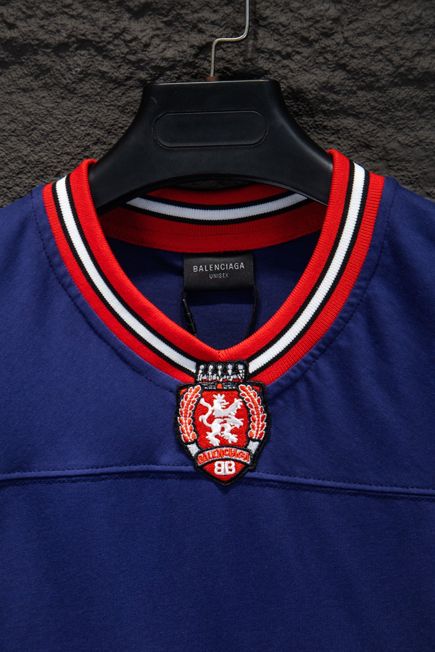 Balenciaga blue short-sleeve shirt neckline with red-and-white trim and crest