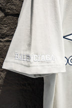 Balenciaga white T-shirt hem with small embroidered logo on lower back