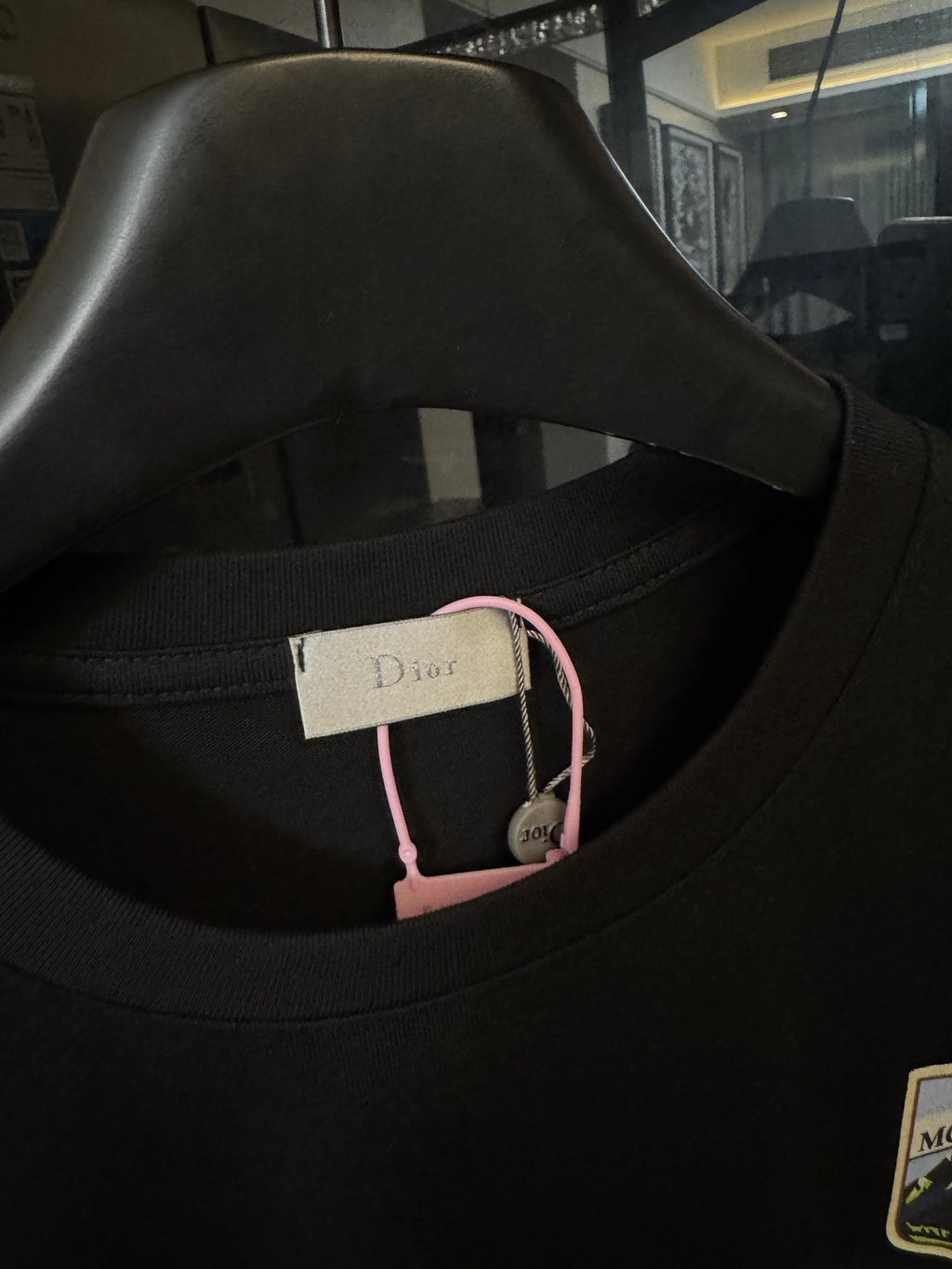 Black crew-neck T-shirt with neck label detail