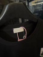 Black crew-neck T-shirt with neck label detail