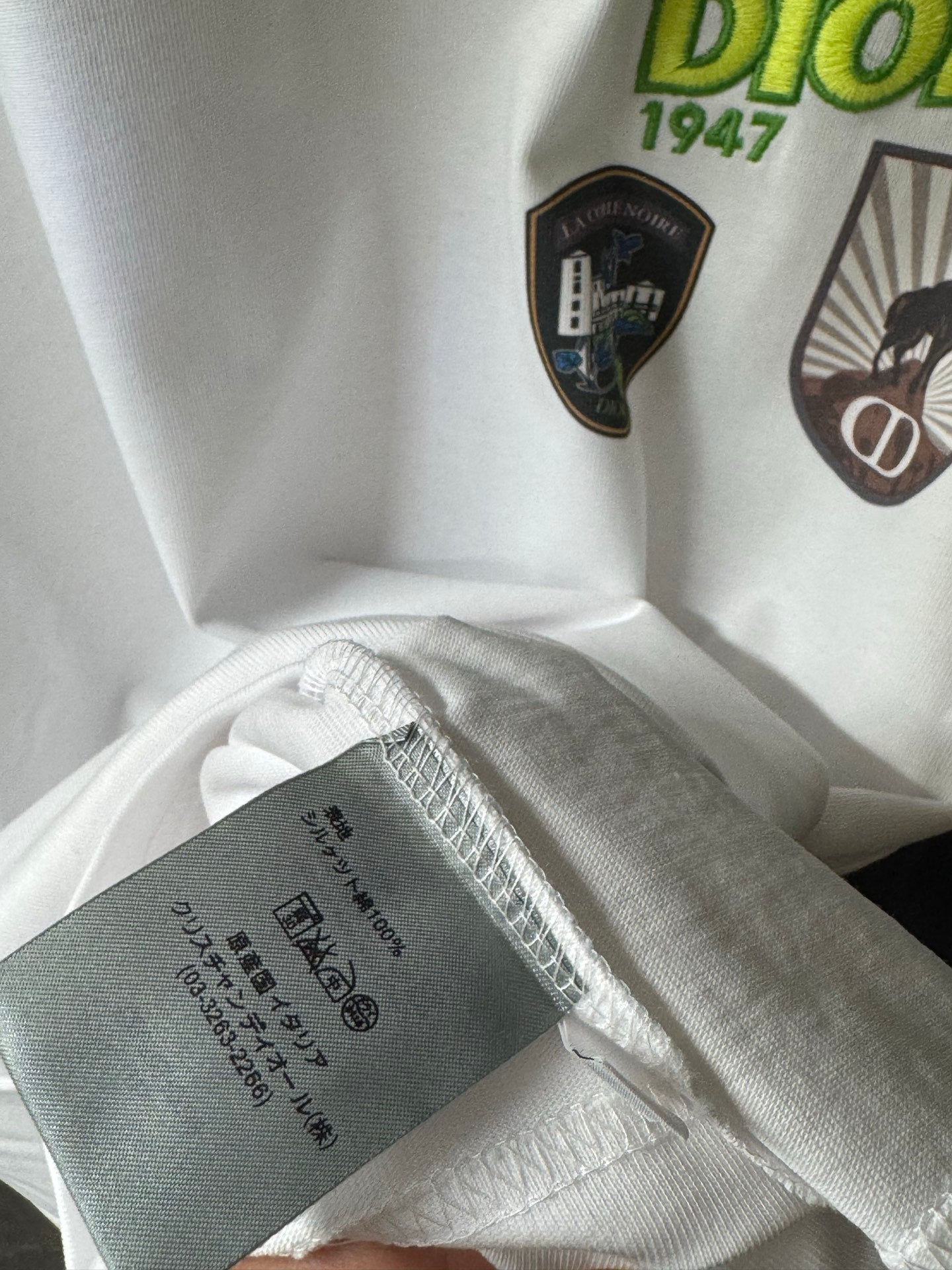 White Dior short-sleeve T-shirt fabric and inner tag near hem