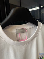 White Dior short-sleeve T-shirt neckline and inner label detail