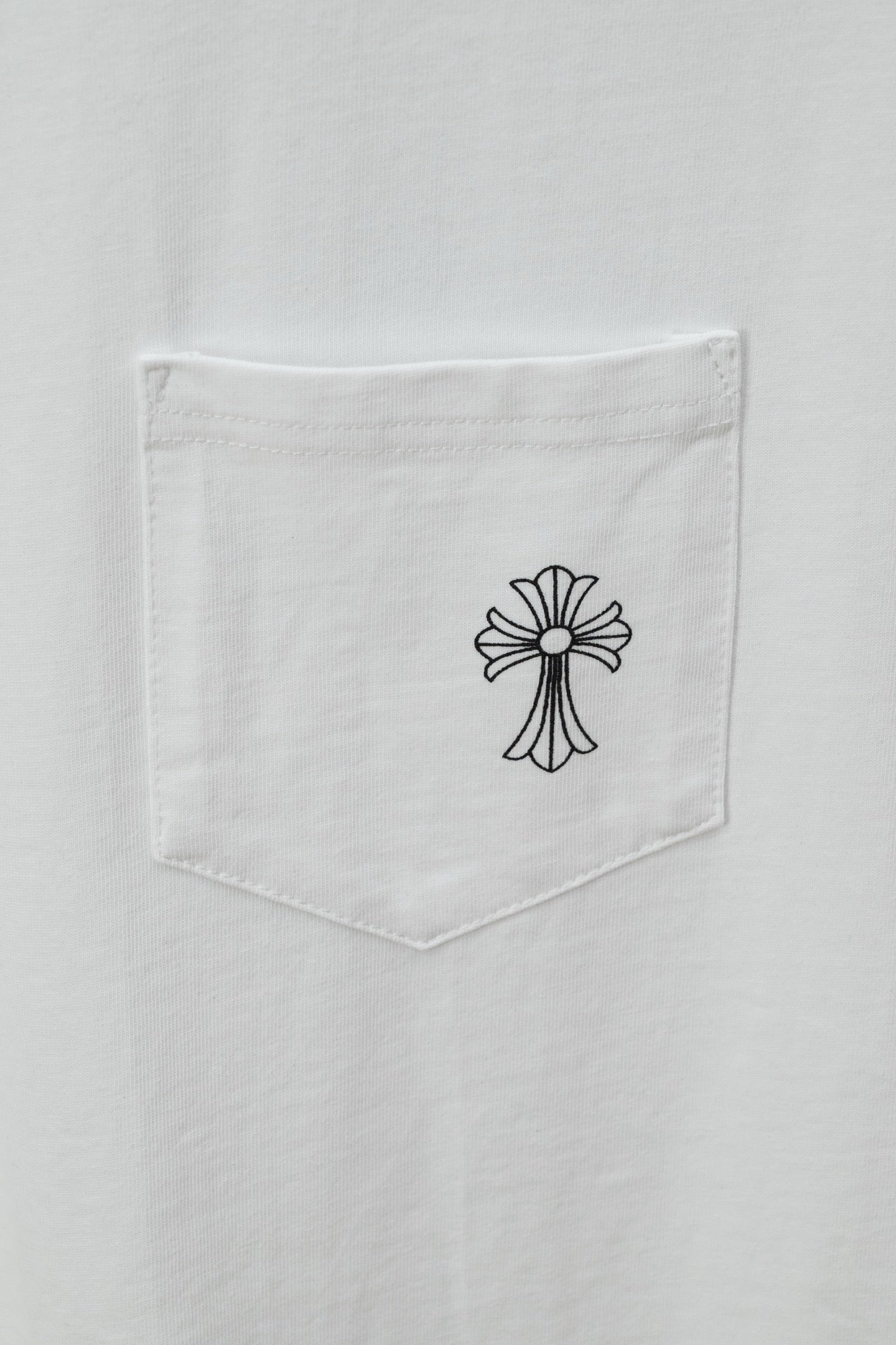 White T-shirt with chest pocket and small cross emblem outline