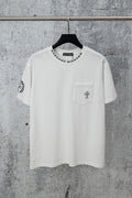 White crew-neck T-shirt with left chest pocket and cross-style graphic print