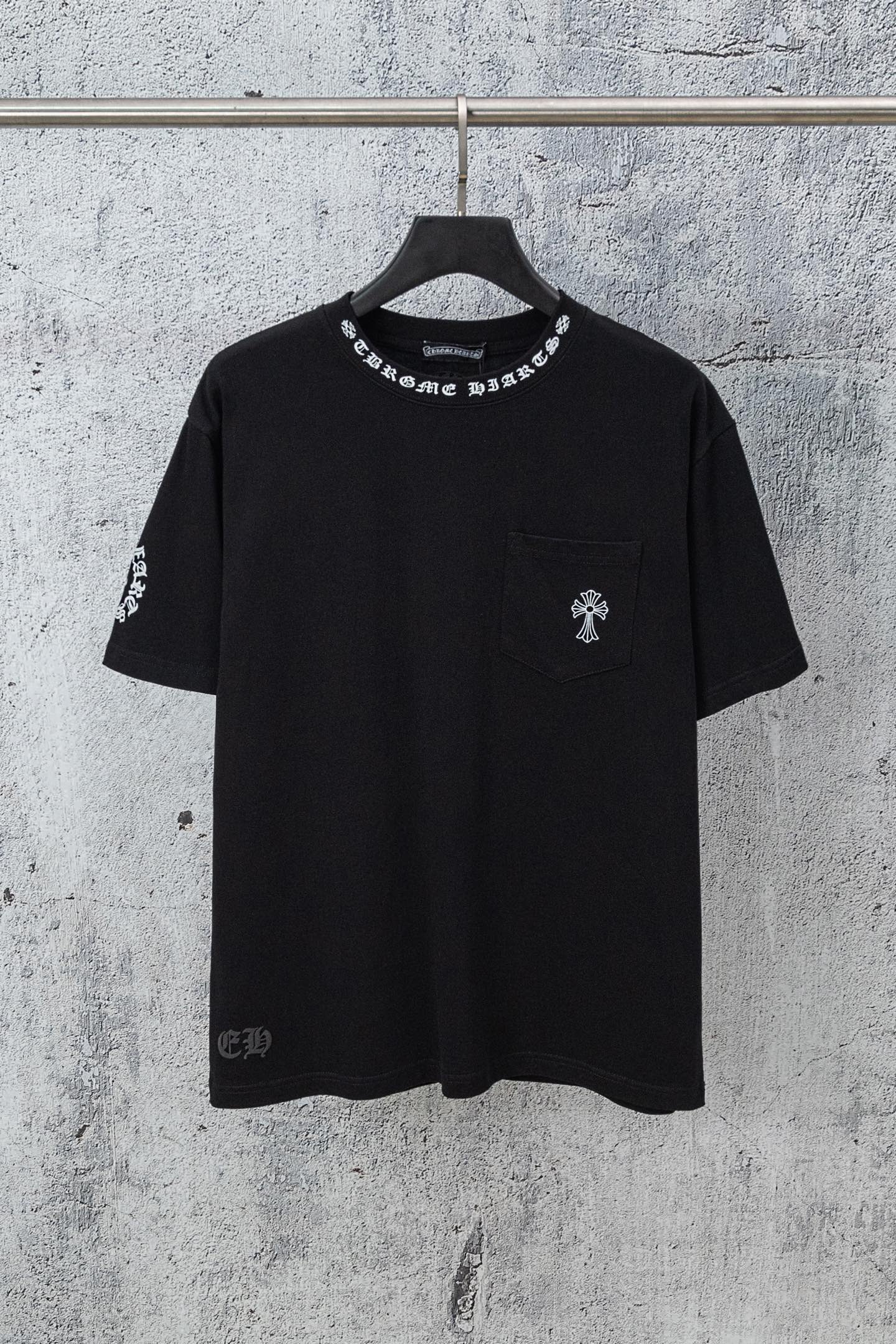 Black crew-neck T-shirt with left chest pocket and cross-style sleeve graphic