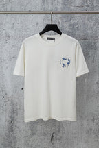 White graphic T-shirt with small blue chest logo and short-sleeve crew neck