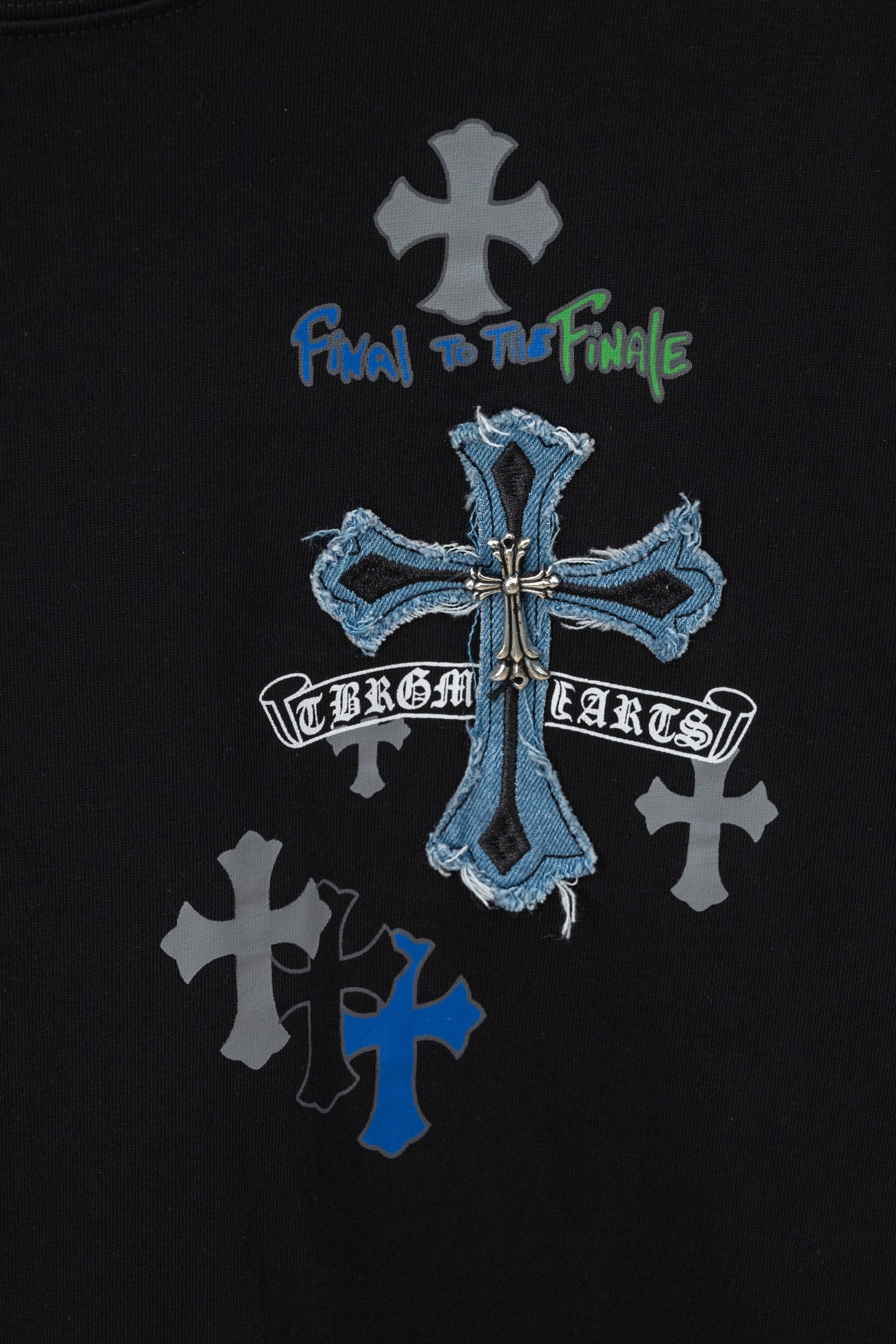 Black crew-neck T-shirt with blue cross and text graphic at center front