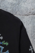 Black short-sleeve T-shirt side seam with small cross and blue lettering