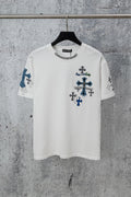 White crew-neck T-shirt with dark and blue cross graphics on chest and sleeves