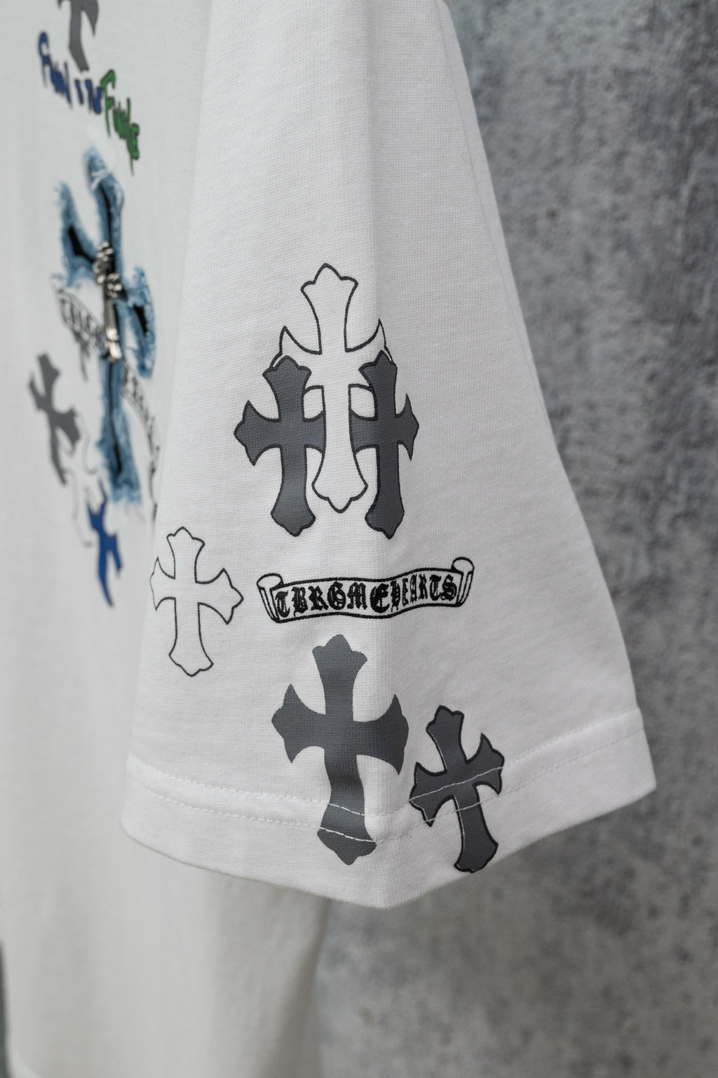 White crew-neck T-shirt with large cross prints on front and sleeve