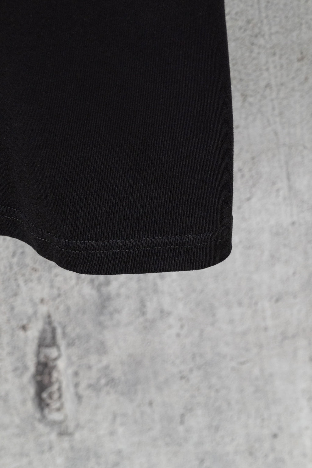 Black short-sleeve T-shirt sleeve hem detail with ribbed cuff