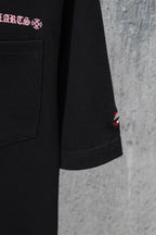 Black short-sleeve T-shirt with chest pocket and small red lips logo