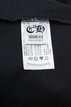 Black short-sleeve T-shirt with fabric care label inside neck