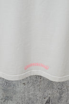 White short-sleeve T-shirt hem with small faded pink logo print