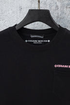 Black short-sleeve T-shirt close-up with neckline text and chest pocket logo