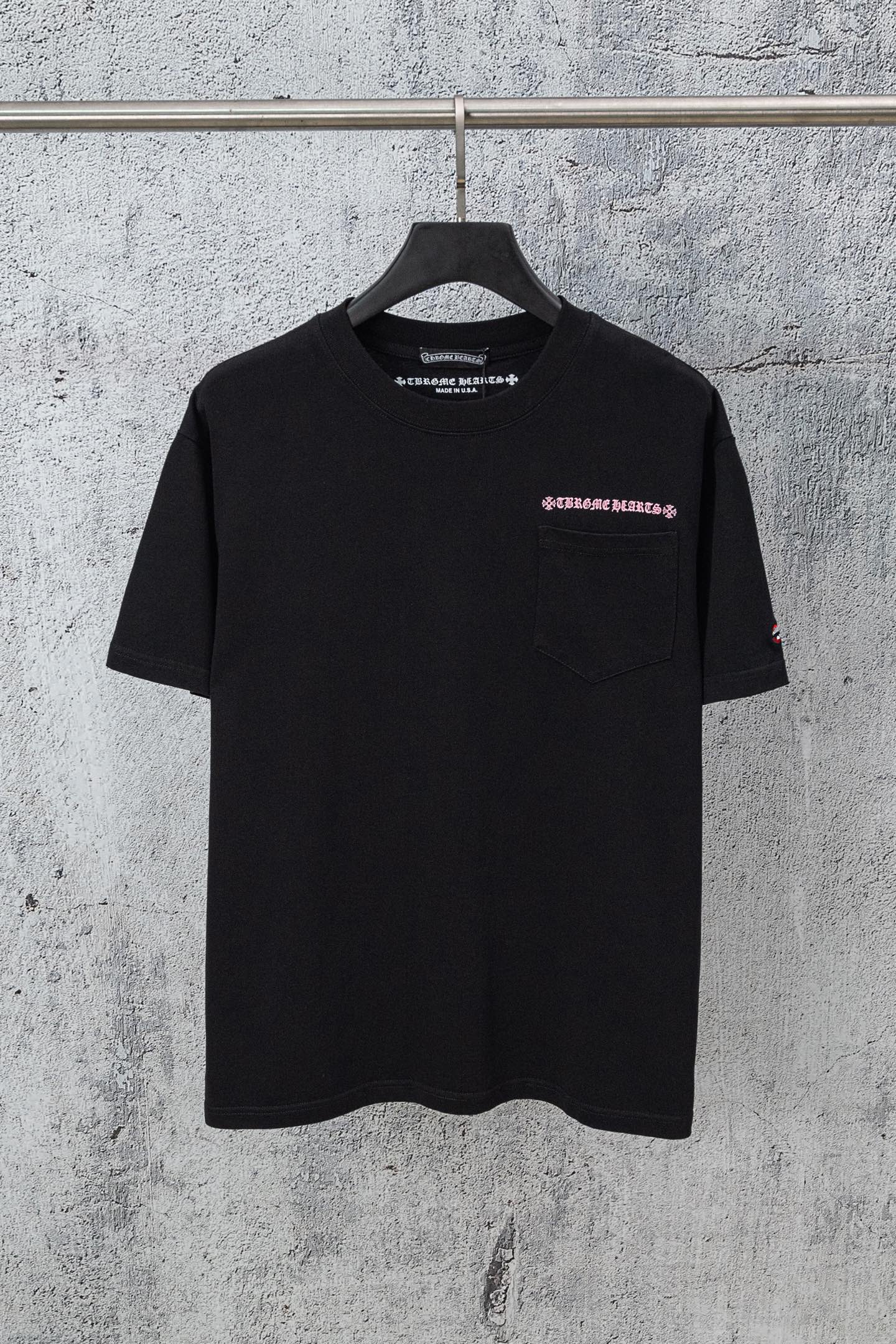 Black short-sleeve T-shirt with small chest logo on left side