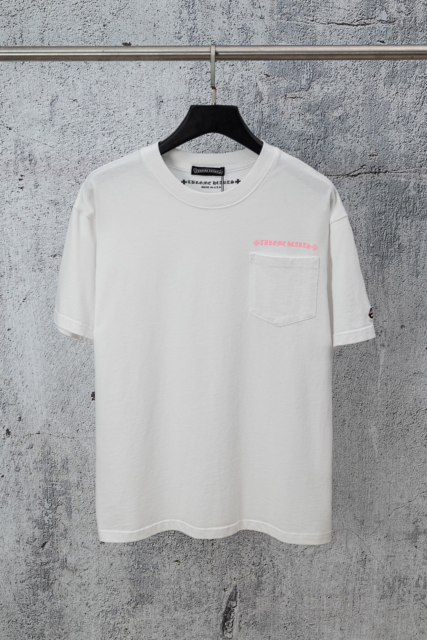 White short-sleeve T-shirt with small chest logo and pocket