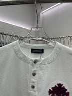 White short-sleeve T-shirt neckline with three dark buttons and maroon chest graphic