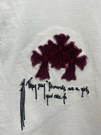 White T-shirt chest graphic: maroon flower shapes with black script lettering