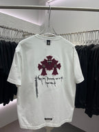 White short-sleeve T-shirt with centered maroon flower graphic and black script text