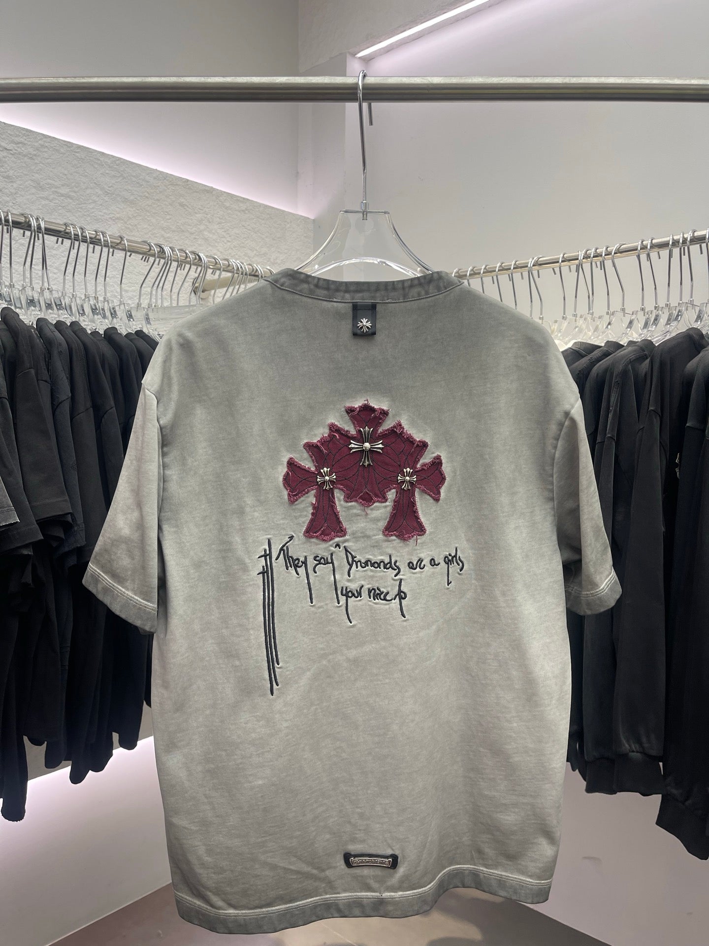 Light gray short-sleeve henley T-shirt with burgundy cross-and-script graphic
