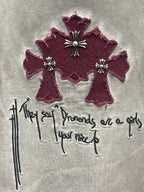 Burgundy cross embroidery with drips and script on a light gray T-shirt