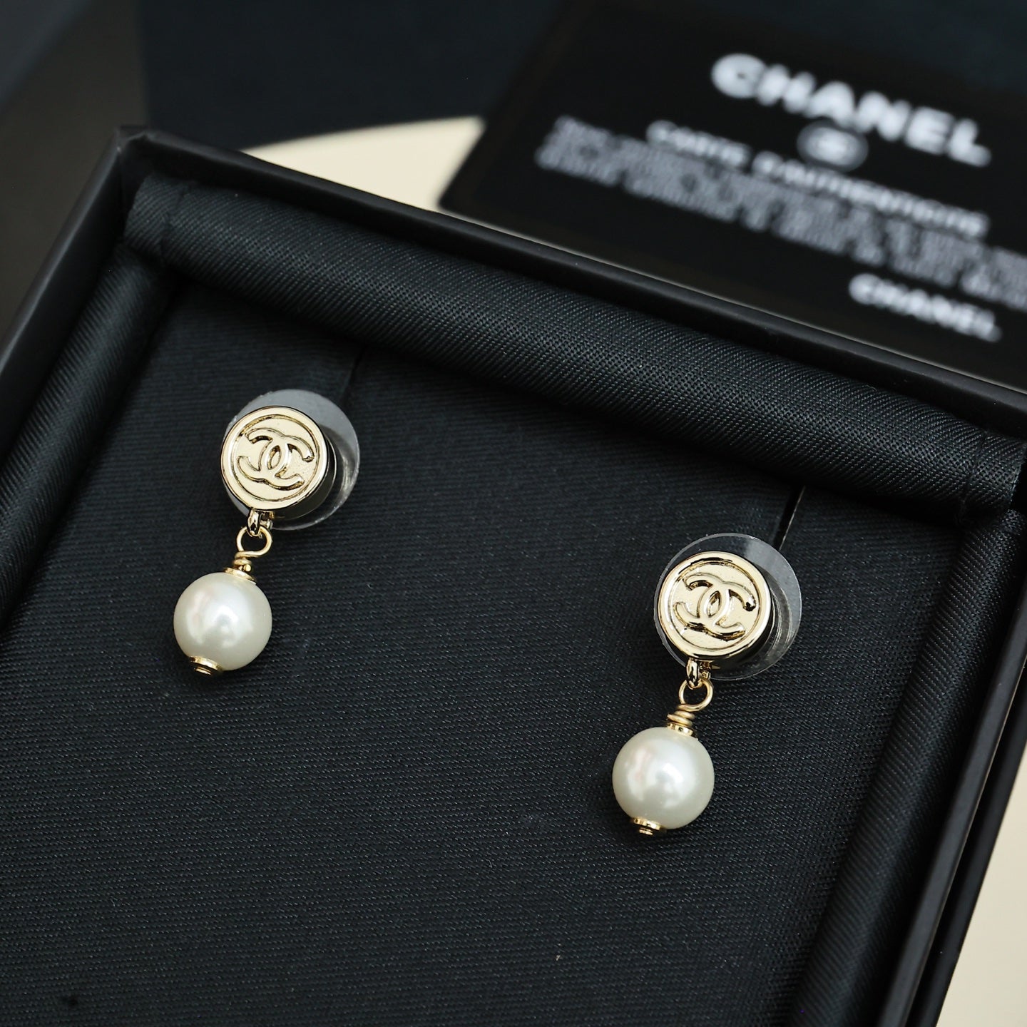 Chanel CC gold-tone pearl drop earrings, front view