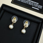 Pair of Chanel CC gold-tone pearl drop earrings in black box