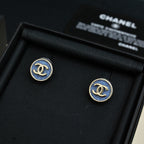 Chanel logo stud earrings with blue enamel in gold-tone circular settings