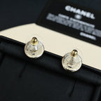 Chanel logo stud earrings with textured silver-tone backs and gold posts