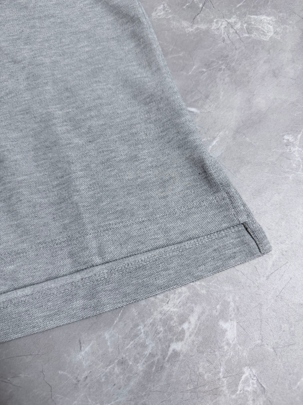 Dior polo shirt hem with short sleeve cuff, light gray knit