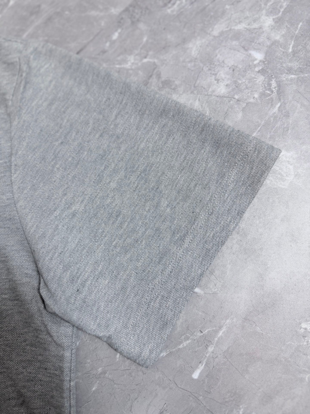 Dior polo shirt side and sleeve hem, light gray knit fabric