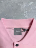 Pink polo neckline with Dior label and button placket