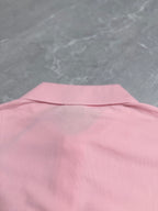 Pink polo shirt back yoke area