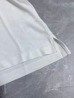 Dior white polo shirt sleeve with stitched cuff and seam detailing