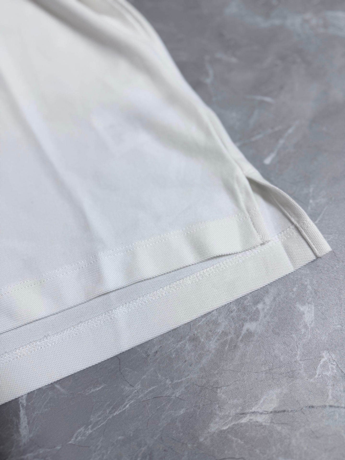 Dior white polo shirt sleeve with stitched cuff and seam detailing