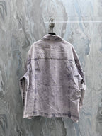Louis Vuitton denim jacket back view with yoke seam and button closure