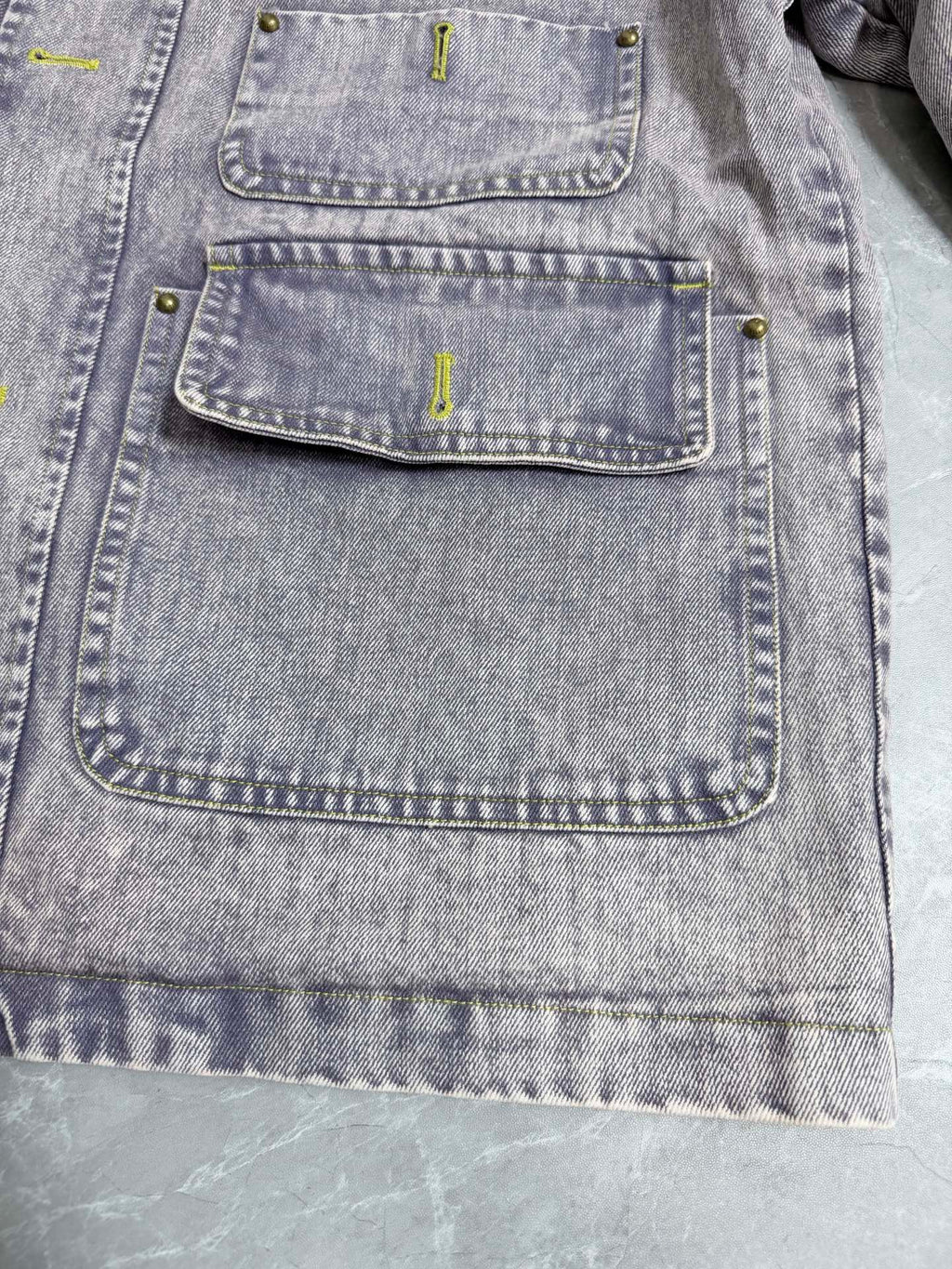 Louis Vuitton denim jacket front with multiple buttoned flap pockets