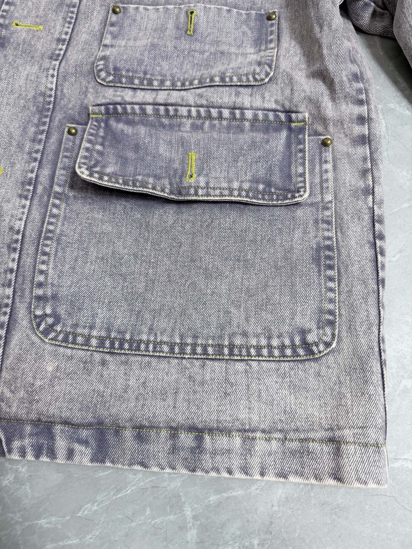 Louis Vuitton denim jacket front with multiple buttoned flap pockets