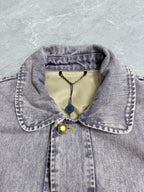 Louis Vuitton denim jacket collar with yellow accents and logo hang tag