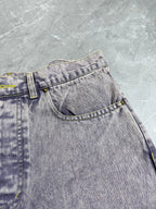 Light-wash Louis Vuitton denim waistband detail with belt loops and button