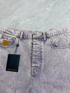 Light-wash Louis Vuitton denim pants with coin pocket and two attached Louis Vuitton hang tags