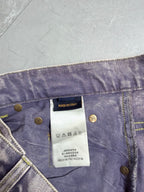 Denim pants waistband detail with gold logo buttons and white brand tag