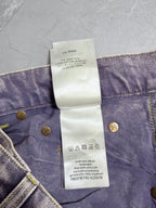 Denim pants waistband care label with country info and gold buttons