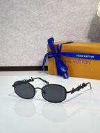 Louis Vuitton sunglasses with black oval frames and dark gradient lenses