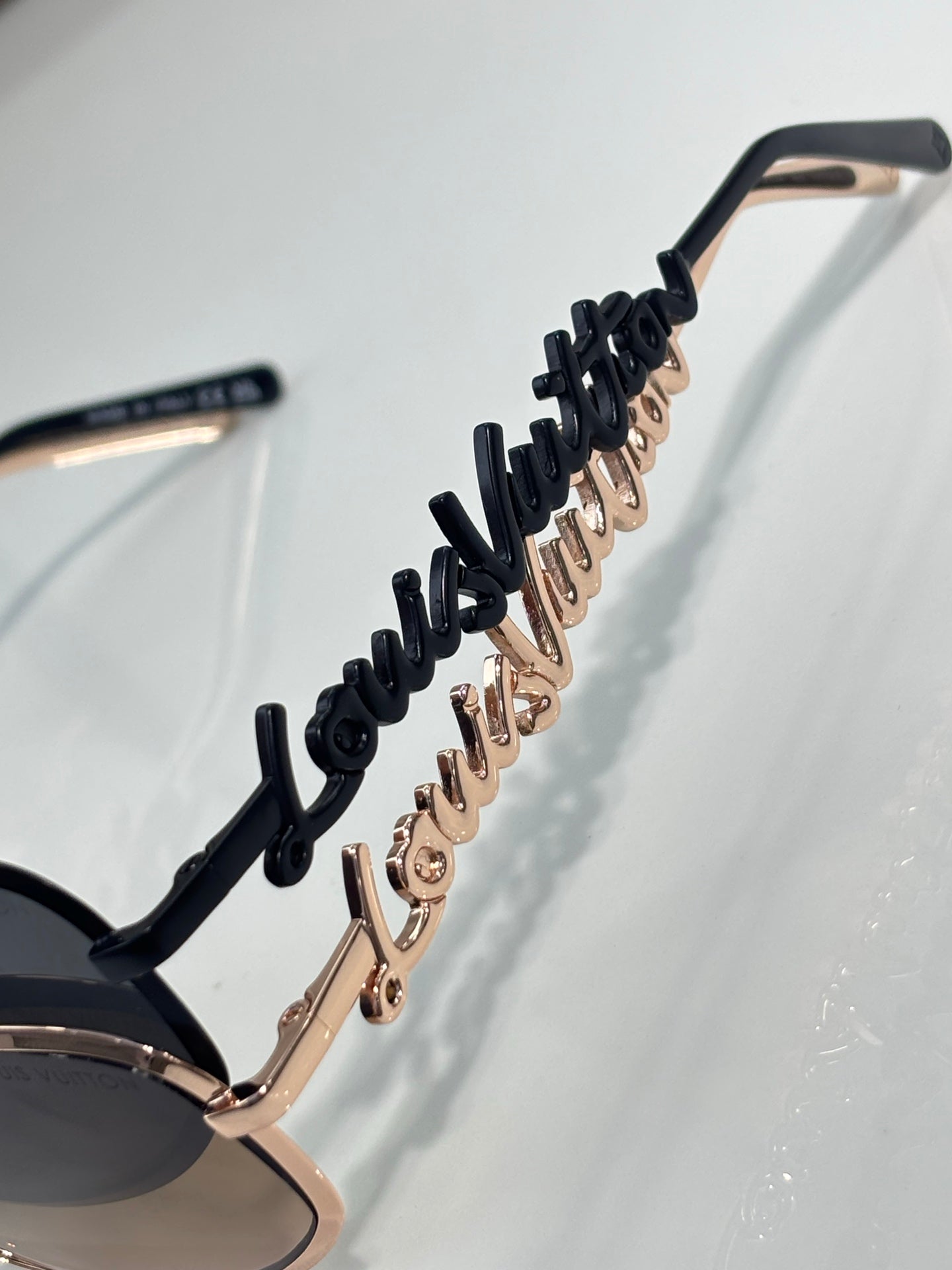 Louis Vuitton sunglasses side temple with black detailing and rose gold accents