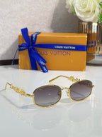 Louis Vuitton sunglasses with gold-tone round frames and dark gradient lenses