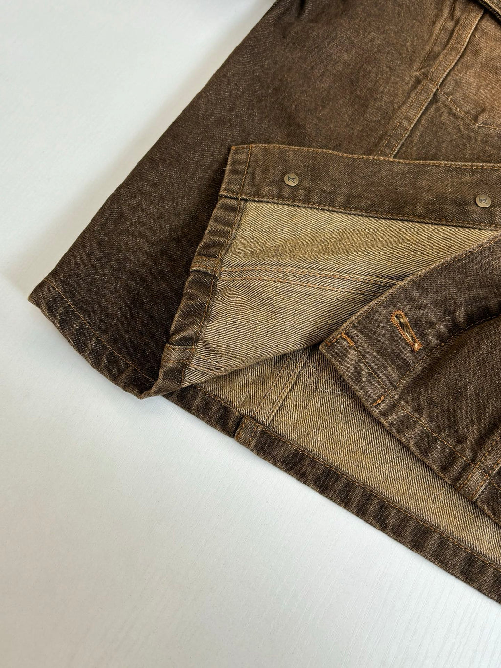 Louis Vuitton brown denim jacket close-up of inner lining and cuff hem