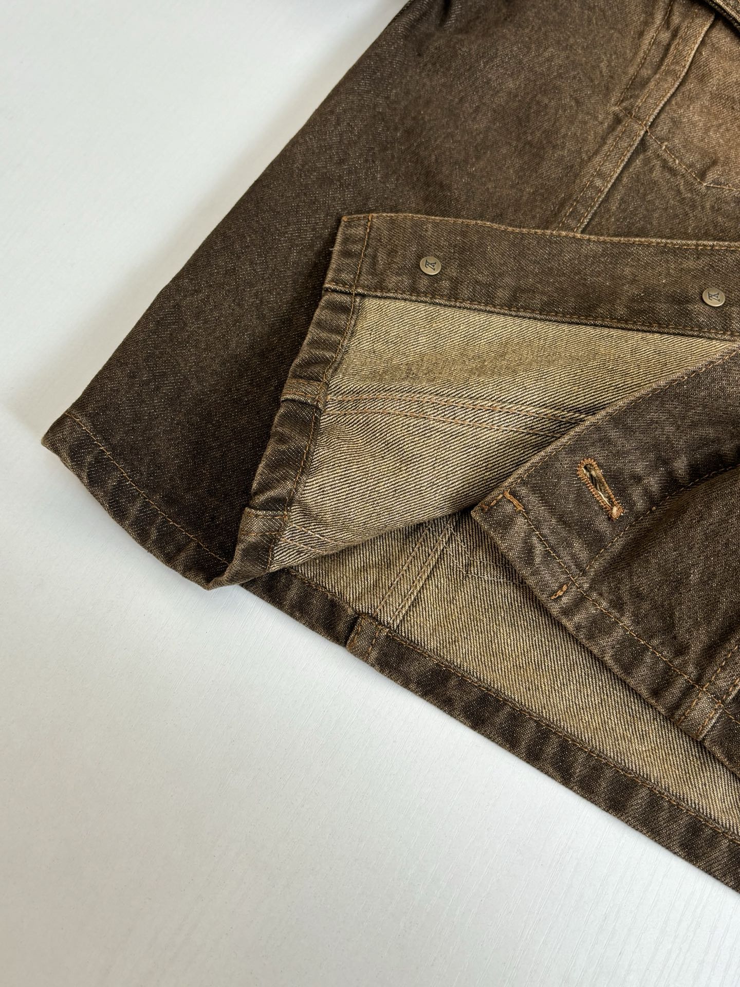 Louis Vuitton brown denim jacket close-up of inner lining and cuff hem